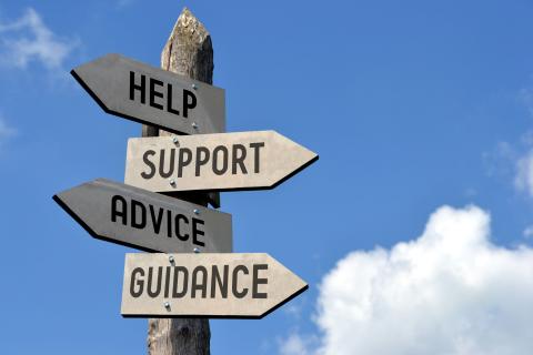 sign post with arrows for help support advice and guidance